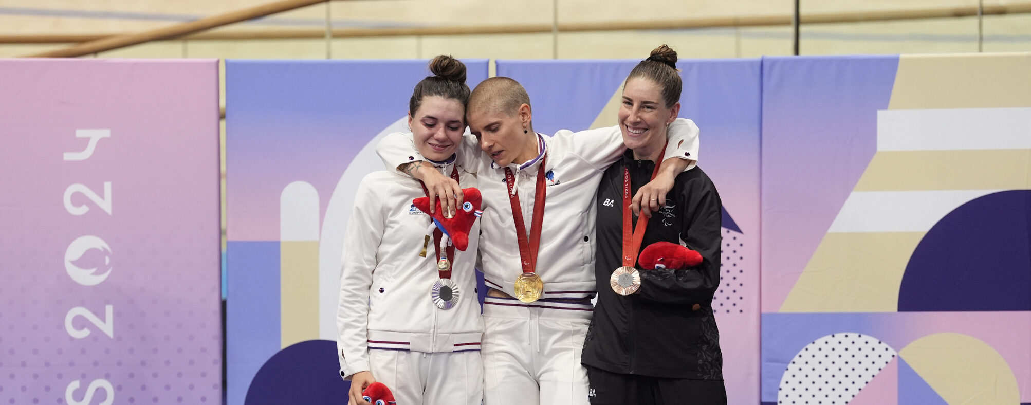 France's Marie Patouillet (centre) with the gold medal, alongside France's Heidi Gaugain (left) with silver and New Zealand's Nicole Murray with bronze after the Women's C5 3000m Individual Pursuit Final at the National Velodrome on day four of the Paris 2024 Summer Paralympic Games. Picture date: Sunday September 1, 2024. - Photo by Icon Sport